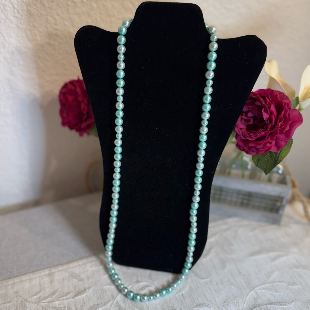 Light blue faux pearl one strand necklace. 10mm and 8mm beads.‎ 17 1/2” long